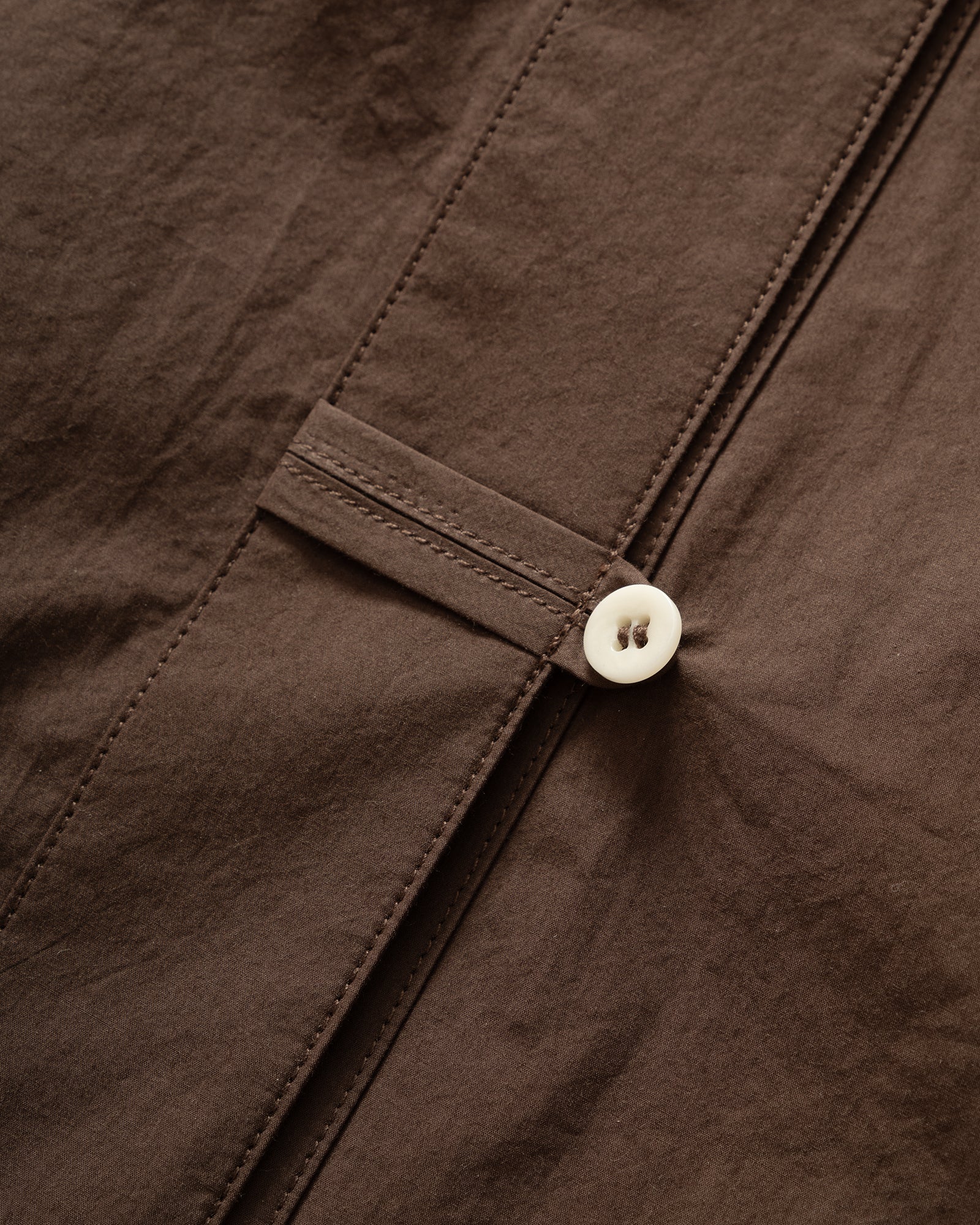 Close up packshot GRAYE plum Sun-Dried Cocoon Top, cord loop button