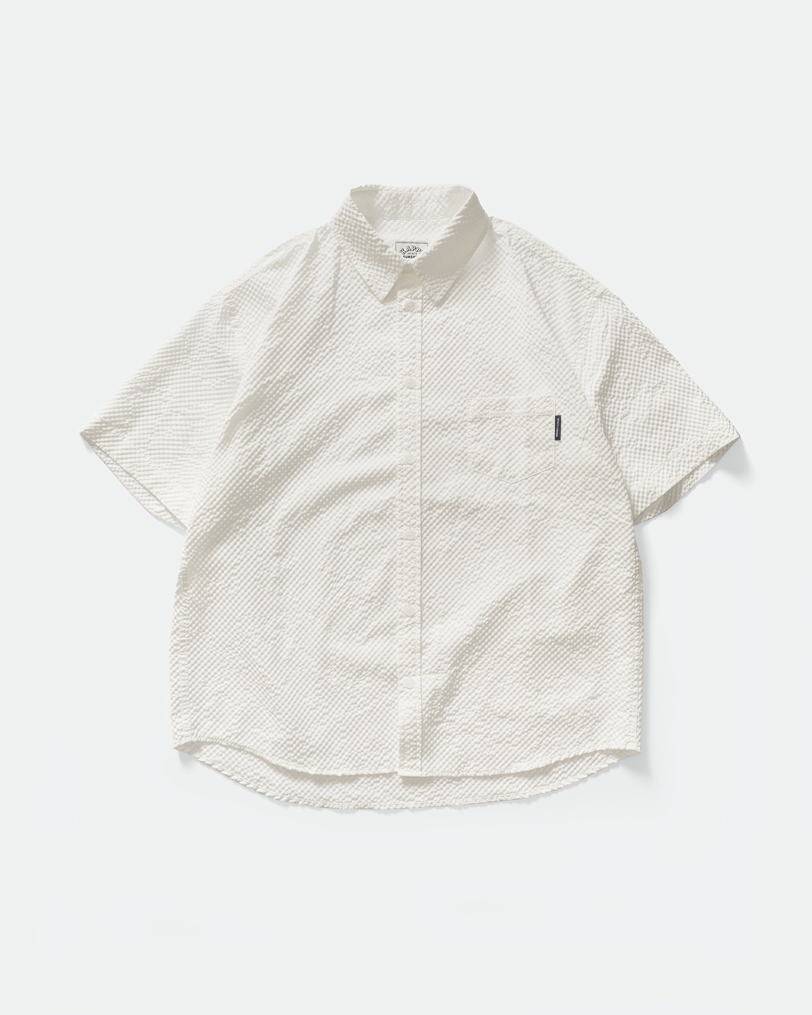 Pack shot of Kappy White Seersucker Check Half Shirt with a collar, label and button fastening on a grey background 