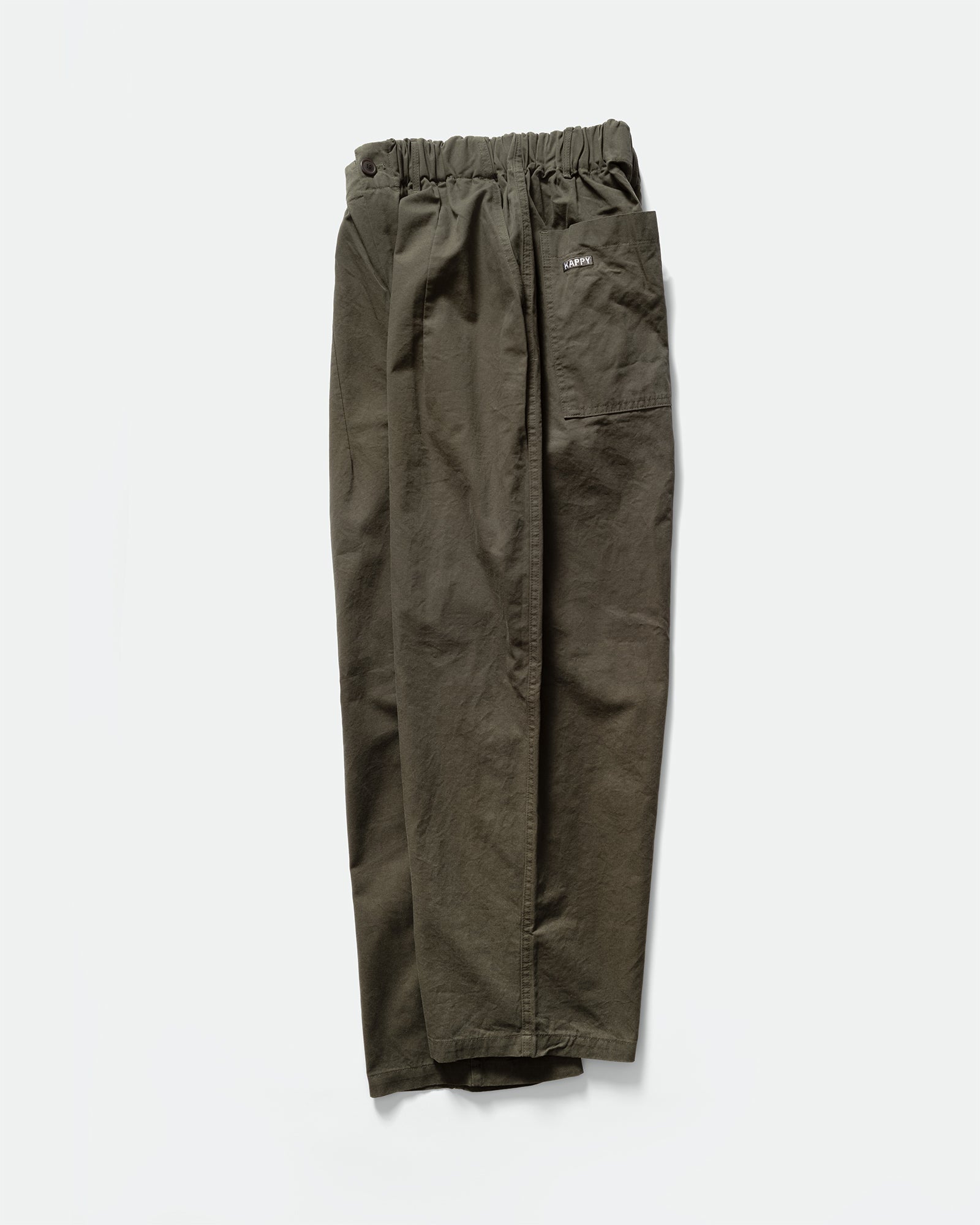Side pack shot of Kappy dark green wide pintuck chino pants with an elasticated waistband, branded label on back pocket on a grey background 