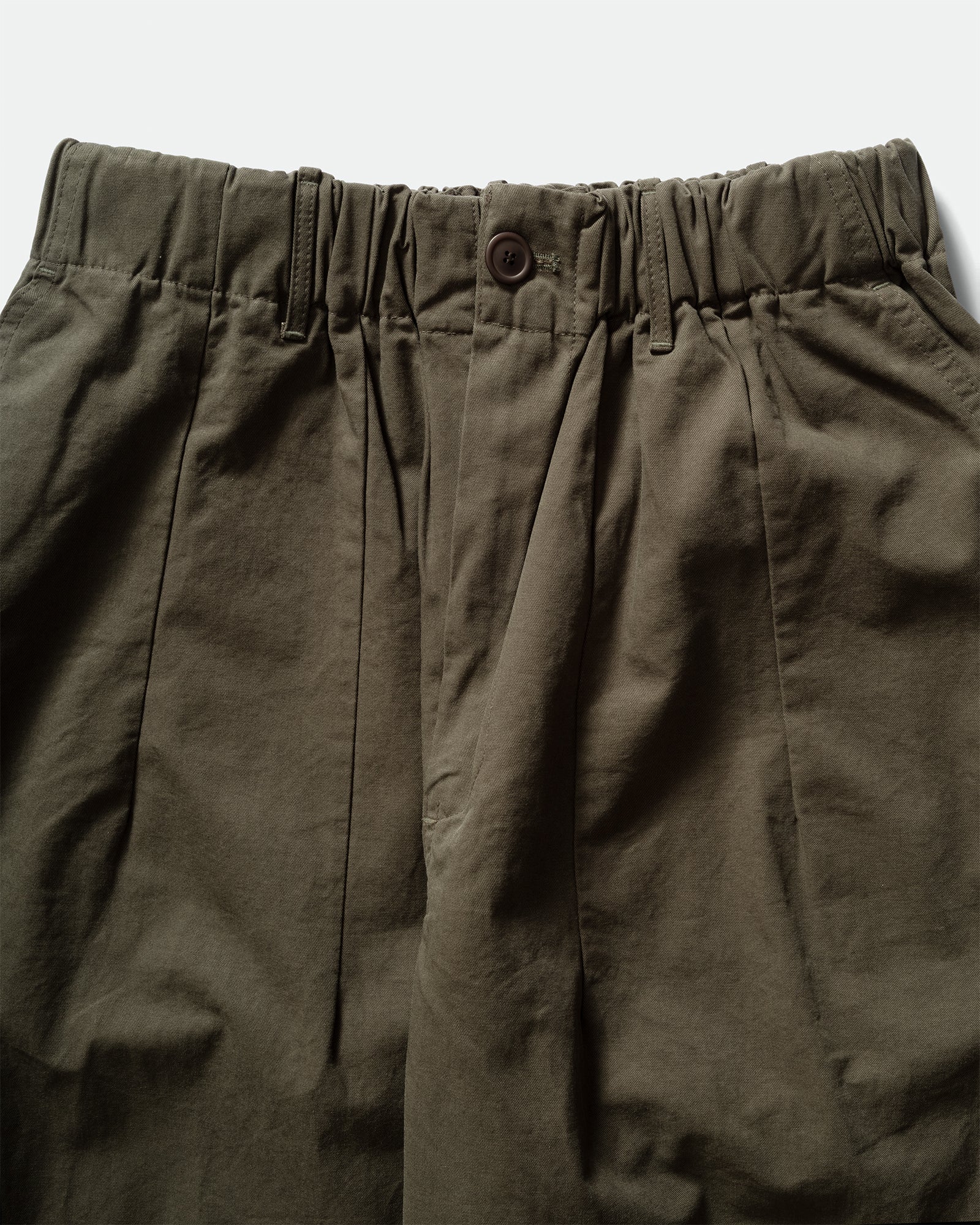 Close-up of dark green Kappy Pintuck Wide Chino Pants with darts, button, elasticated waistband and belt loops