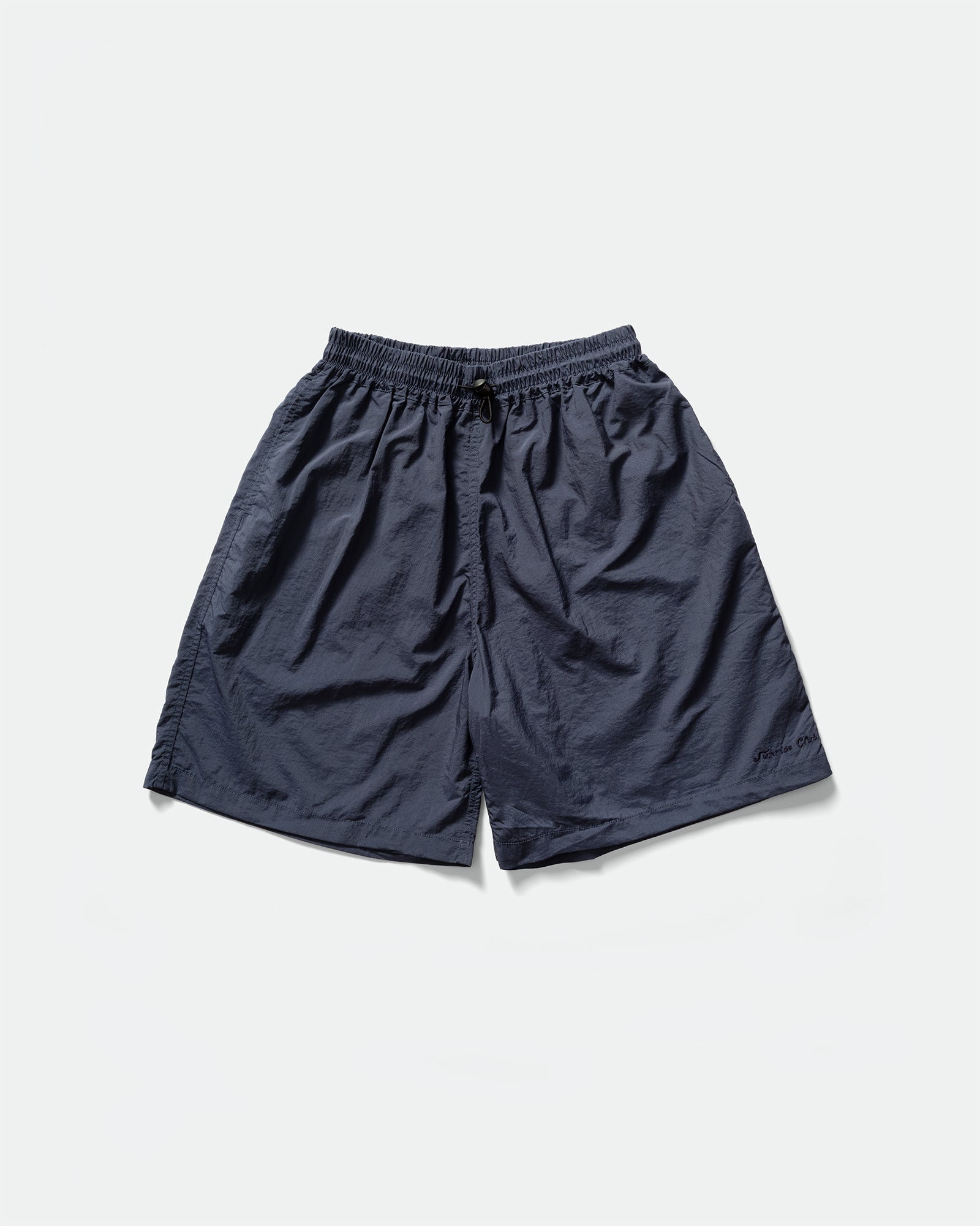 Pack shot of Kappy navy nylon shorts with an elasticated drawstring waistband on a grey background 