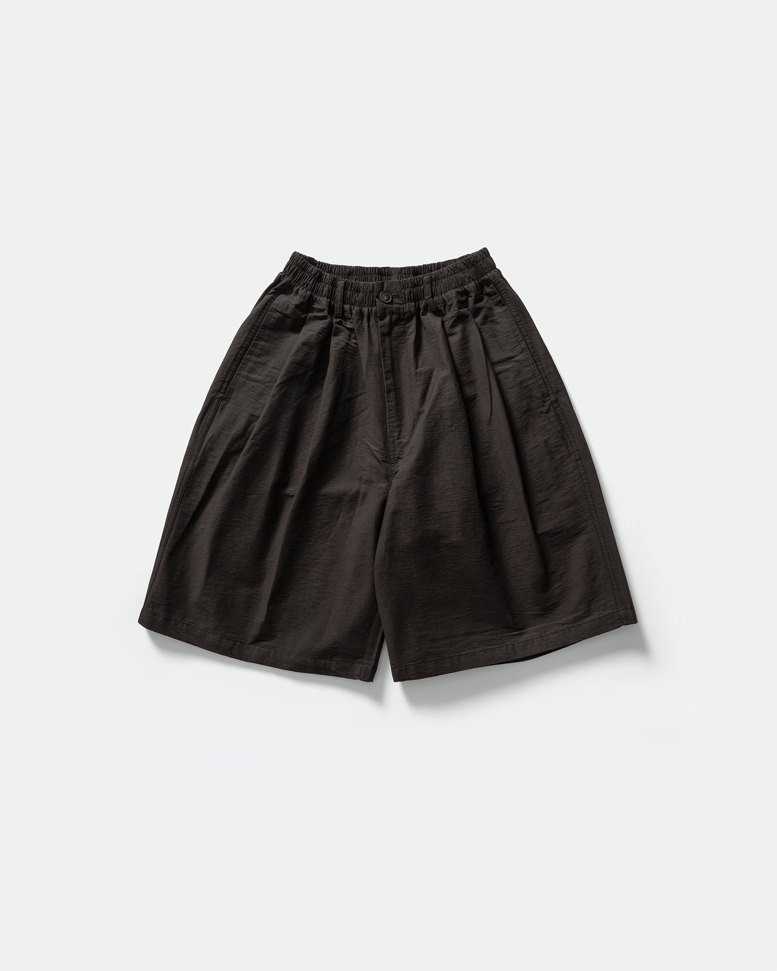Pack shot of cotton black CN shorts with elasticated waistband, pockets and button hole by South Korean brand Kappy 