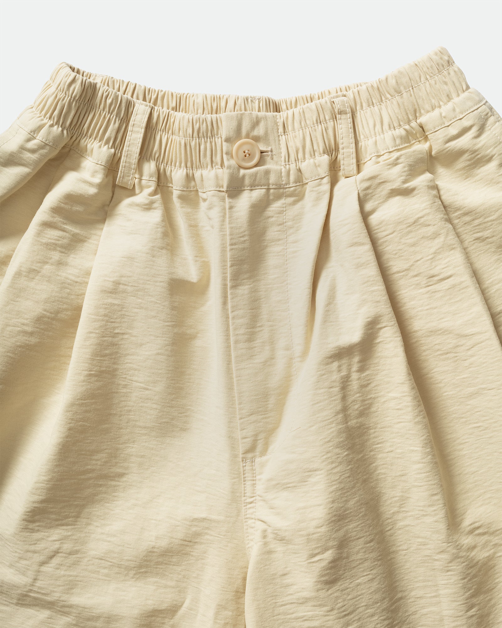 Close-up of black shorts with an elastic waistband, belt loops on a light gray background by South Korean brand, Kappy