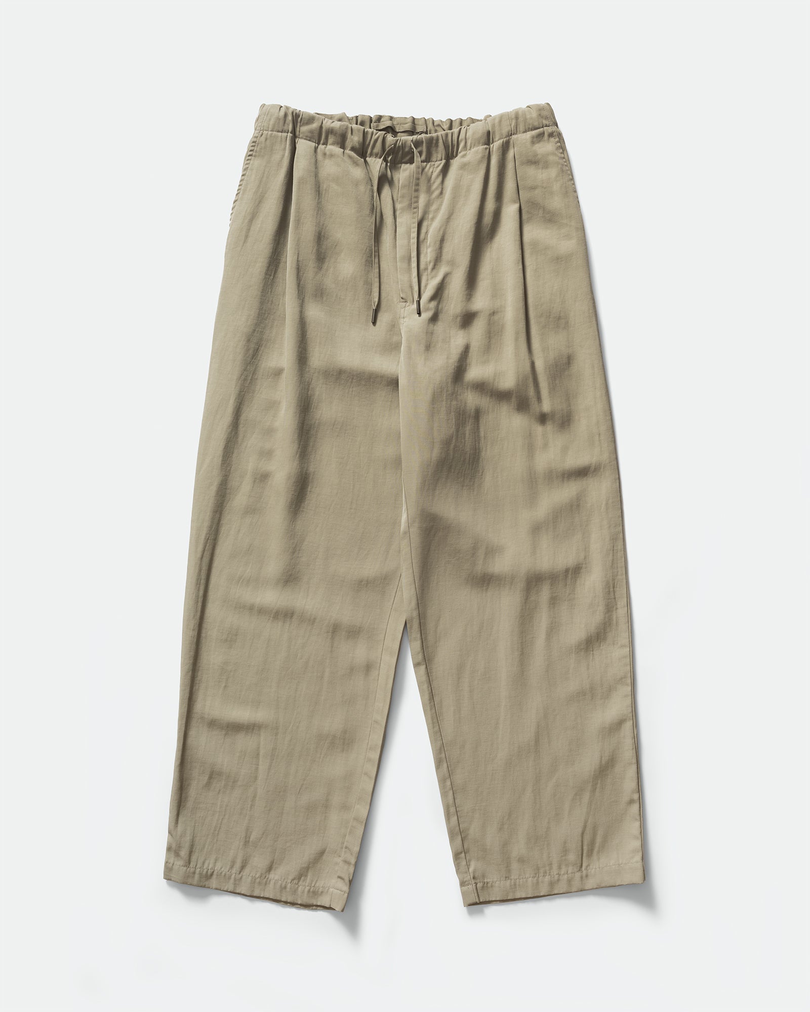 Pack shot of Still By Hand Sage Pigment Print Easy Pants with a drawstring waistband and slip pockets on a grey background.