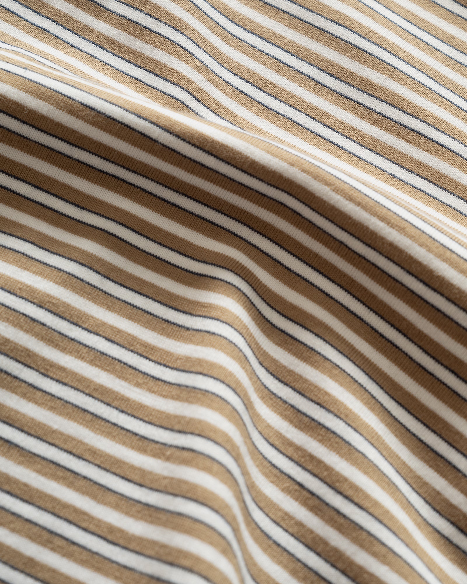 Close up of Still By Hand Striped Beige White T-shirt material