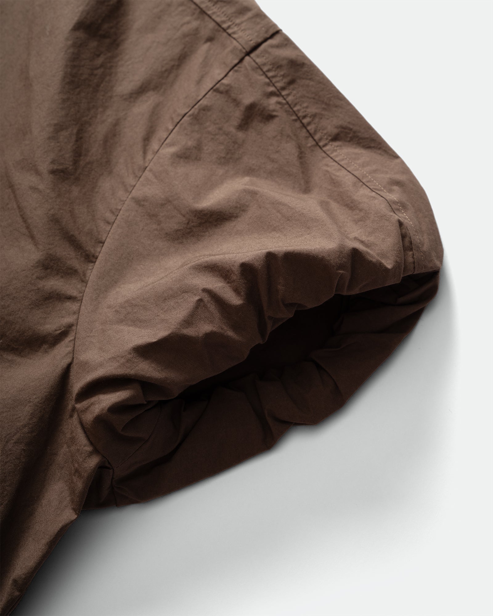 Close up packshot GRAYE plm Sun-Dried Cocoon Top Elasticated Bubble Sleeves on a grey background